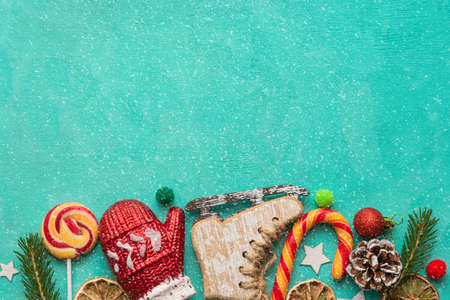 Christmas decorations for the tree, sweets on a green background. Flat lay. There is room for text. Christmas and New Year concept.の写真素材