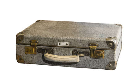 A gray, damaged, shabby suitcase with a white handle and metal corners on a white background. isolated.の写真素材