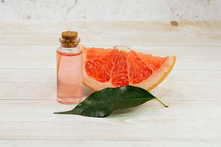 A bottle of grapefruit essential oil. aromatherapy. alternative medicine.の写真素材