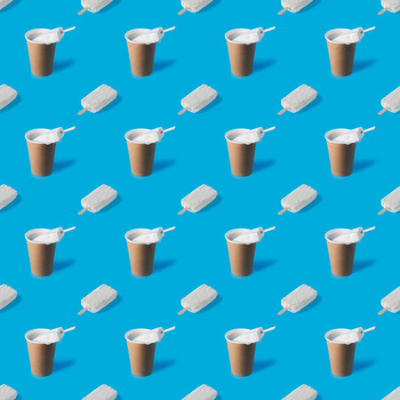 A repeating pattern of a cup of coffee and two briquettes of white creamy ice cream on a blue...