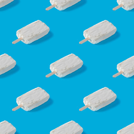 Repeating pattern of white creamy ice cream on a blue background.