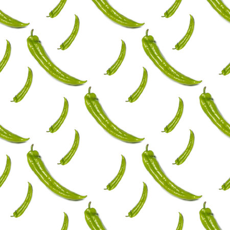 Spicy green fresh pepper on a white background. Pattern of green jalapeno peppers.の写真素材