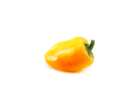 One fresh, ripe, yellow-orange bell pepper. isolated.の写真素材