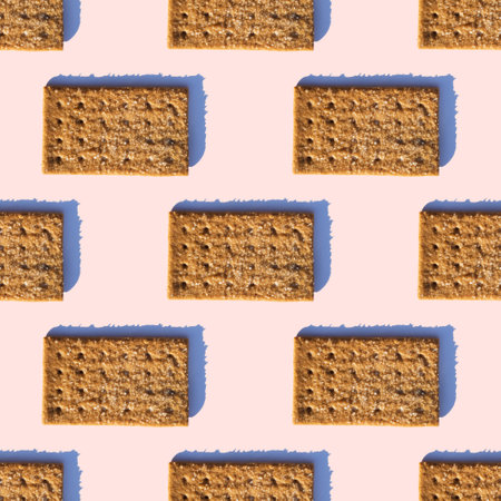 Pattern of sugar rectangular cookies with a shadow on a pink background. The cookies are arranged horizontally.の写真素材