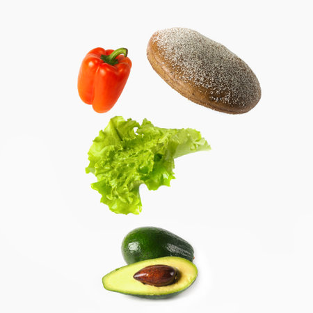Levitation of ingredients for an avocado sandwich on a white background. flying products.の写真素材