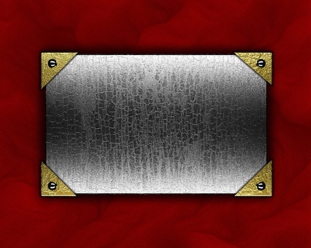 metal plate on a red backgroundの写真素材