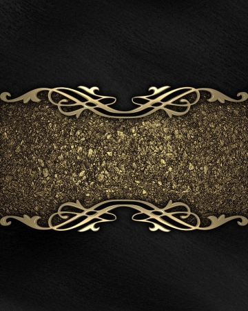 Pattern on a gold plate on a black backgroundの写真素材