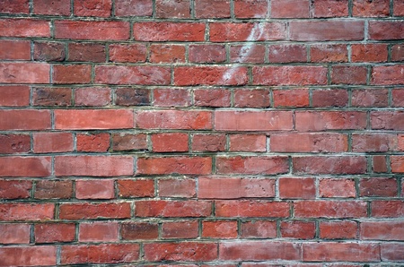Weathered stained old brick wall background