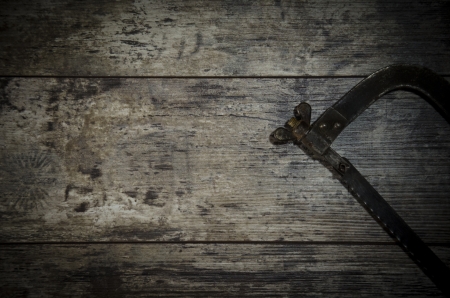 rusty Sawback for metal on the wooden background construction instruments on the wooden backgroundの写真素材
