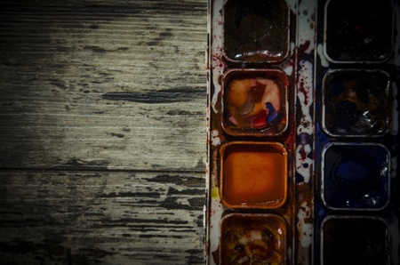 Watercolor paint on old wooden backgroundの写真素材