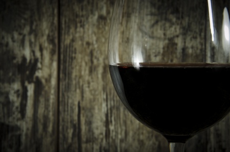 Red wine on old wooden backgroundの写真素材
