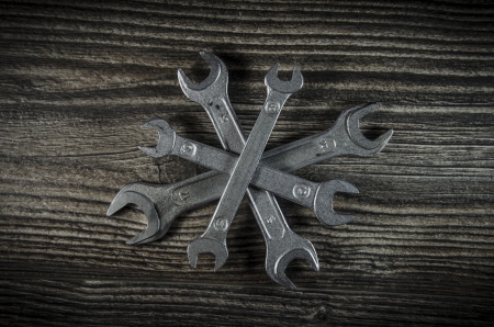 Set of wrenches on wooden backgroundの写真素材