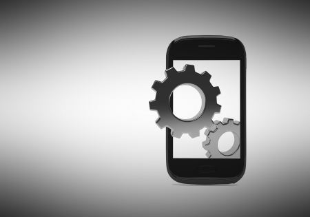 Innovative ideas in smartphones on a grey background. Gears climbs from the screenの写真素材