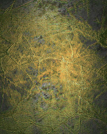 Grunge gold metal texture with green scuffedの写真素材
