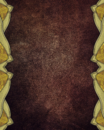 Grunge brown background with gold ornaments on the edgesの写真素材