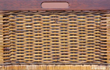 A woven basket drawer possible use as a background.の写真素材
