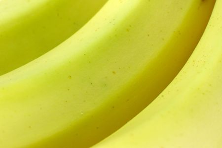A background close-up of some ripe bananas.の写真素材