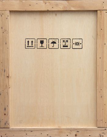 A wooden packing crate with various packing symbols.の写真素材