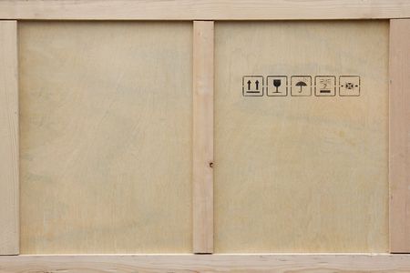 A wooden packing crate with various packing symbols.の写真素材