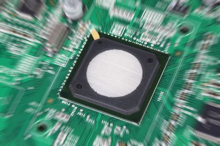 Electronic circuit board. Lens zoomed with focus on blank component surface.