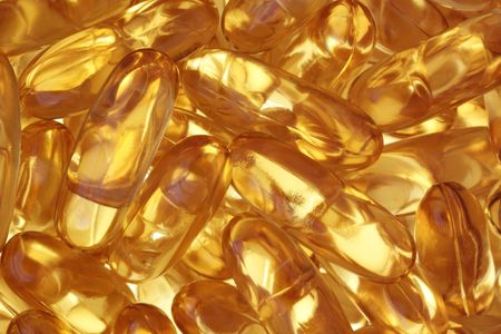 A background of omega-3 rich fish oil capsules.