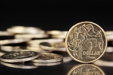 Various australian coins on a dark reflective background.の写真素材