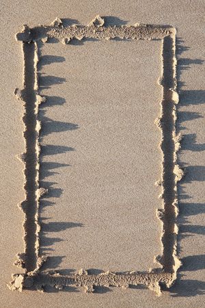 A border or frame made in the sand at the beach.の写真素材