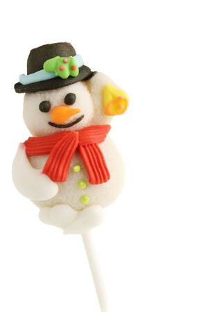A fruit flavoured snowman xmas lollypop treat on a stick.の写真素材