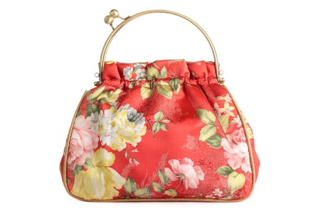 A floral pattern womens hand bag, isolated on a white background.の写真素材