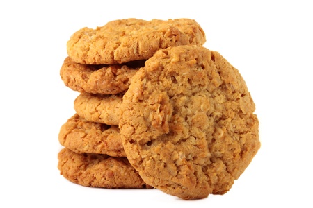 A stack of sweet biscuits, known in Australia as "ANZAC" biscuits. Isolated on a white background.の写真素材