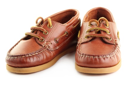 A pair of childrens boat shoes or top-siders, isolated on a white background.の写真素材