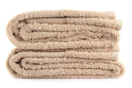 A stack of bath towels, isolated on a white background.の写真素材