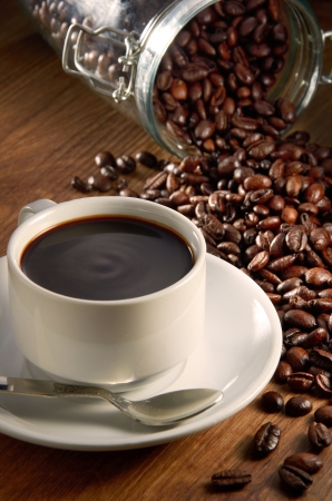 Coffee cup with coffee beans backgroundの写真素材