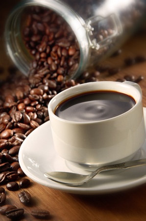 Coffee cup with coffee beans backgroundの写真素材