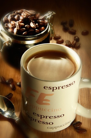 Coffee cup with coffee beans backgroundの写真素材