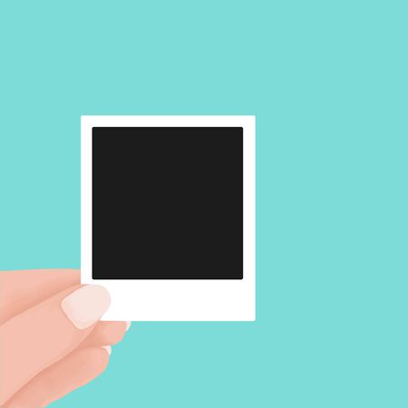 hand holding blank retro paper photo frame. instant photo frame polaroid concept. Vector flat cartoon illustration for web sites and banners design.のイラスト素材