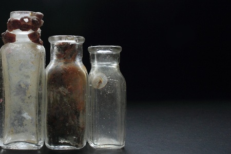 Small medecine bottles recovered from a WW II era shipwreck off of the South Carolina coast  They are believed to have contained morphine  Off center from left to rightの写真素材