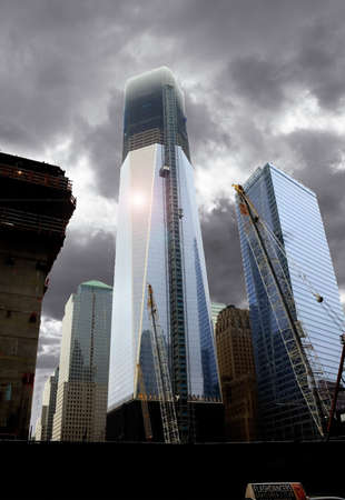The Freedom Tower and other construction rising from the ground zero site and towering into the...