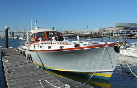 a boat sits at dock in marina