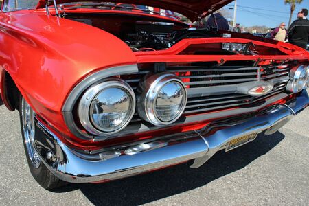A classic Chevy hot rod. Chromed out engine grill,and front end, hood up  at the Run to the Sun car show in Myrtle Beach, SC USA March 15th 2013.のeditorial素材