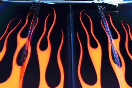A flame design paint job adorns the hood of a classic car.のeditorial素材