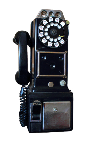 Image of an antique rotary pay phone isolated on a white .
