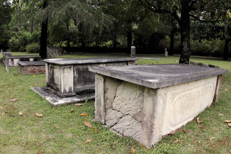 A row of old crypts in the cemetary at All Saints Church in Pawleys Island, South Carolina, USAのeditorial素材