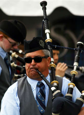 A bagpiper plays at the Inaugaral Highland Games in Myrtle Beach South Carolina. Photographed March 19, 2016 at the Market Commons of Myrtle Beach.のeditorial素材