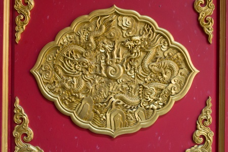 gold dragon on red background の写真素材