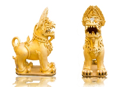 Thai golden lion statue style on white background This statue is public in thailand  No any trademark or restrict matter in this photo の写真素材