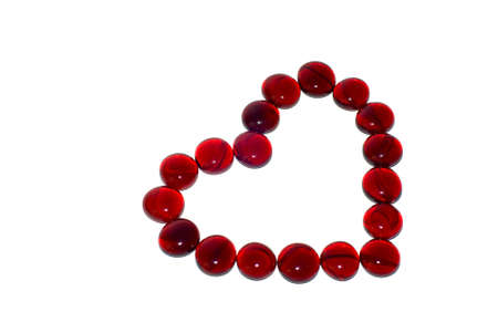 red glass shape of a heart の写真素材