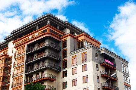 Modern apartments on the clear sky background