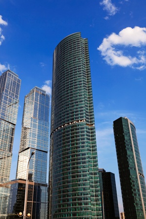 Skyscrepers in business centre in a sky backgroundの写真素材