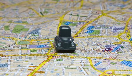 Small car on the map of Londonの写真素材